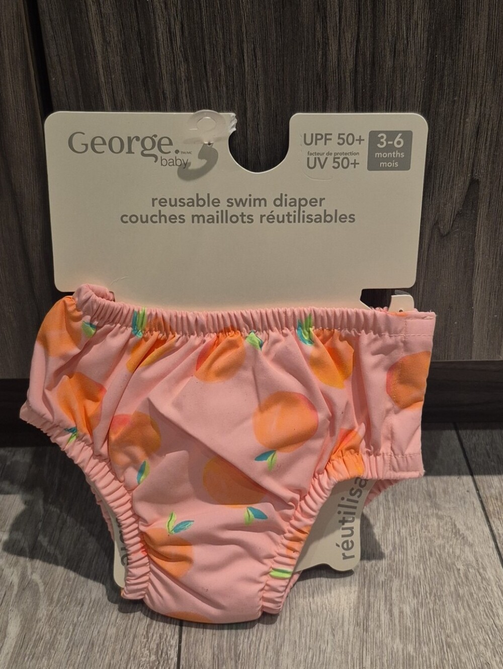 George Baby Pink Peach Print Reusable Swim Diaper With UPF 50+ Rating.